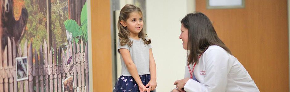 A Weill Cornell Medicine physician interacts with a patient.