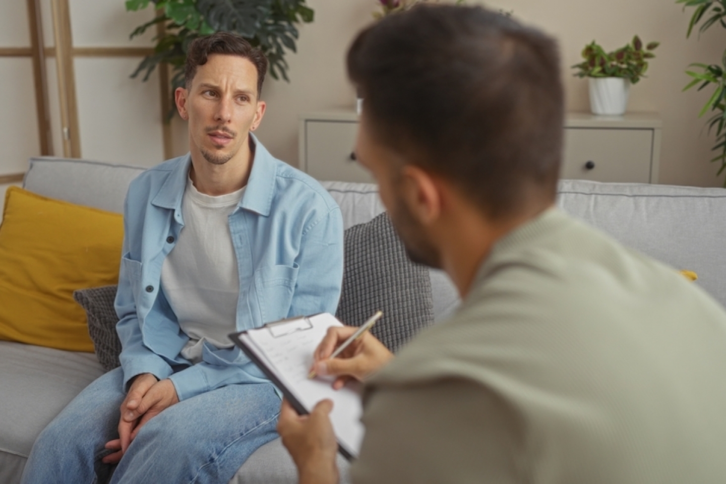 man speaking with doctor